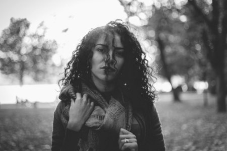 Grayscale Photo Of Woman Wearing Scarf photo