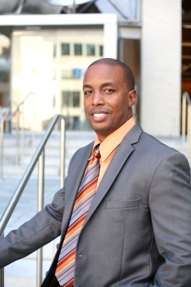 Man Wearing Gray Blazer And Orange Dress Shirt photo