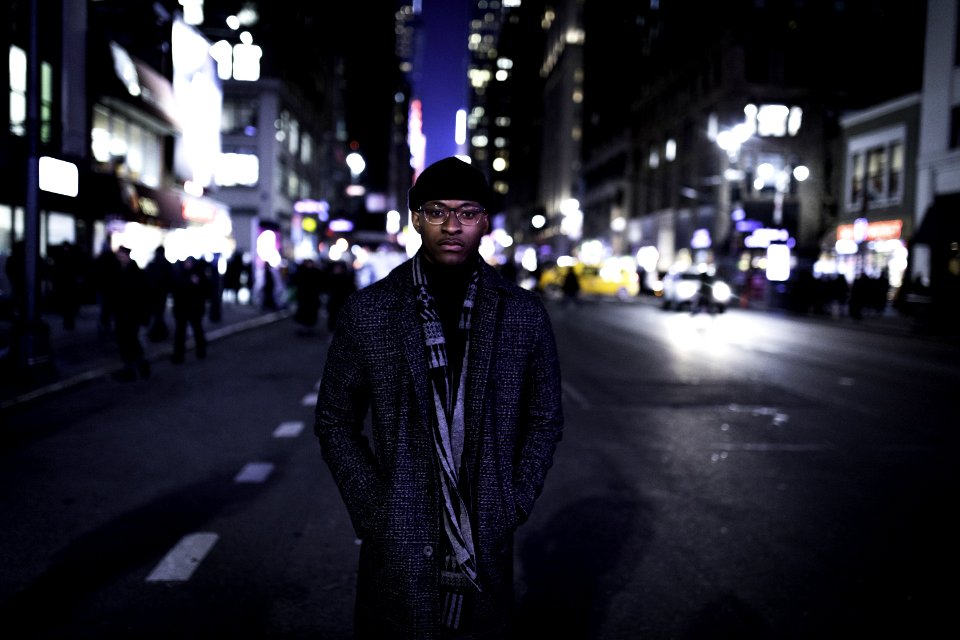 Man Wearing Gray Coat Standing In The Middle Of The Road