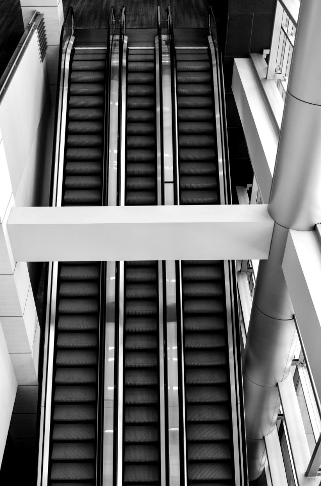 Grayscale Photo Of Escalator
