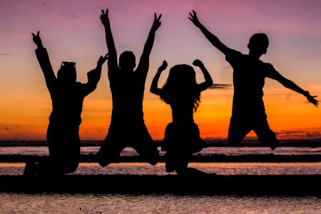 Silhouette Of People Jumping photo