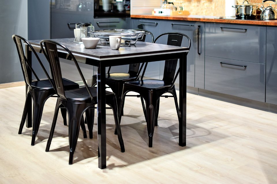 White Ceramic Mug On Black Dining Table With Four Chair Set