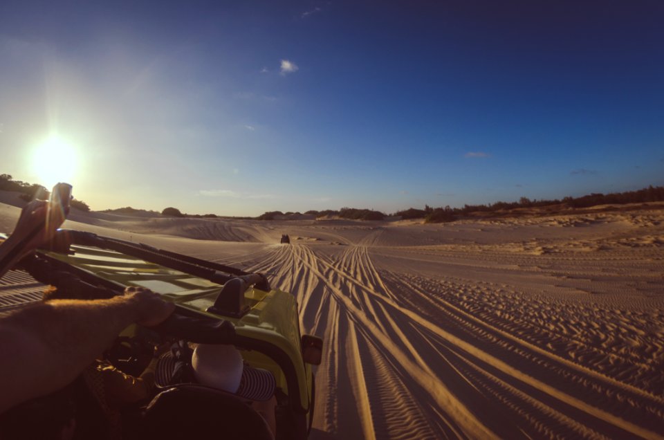 Person Riding Yellow Dune Buggy