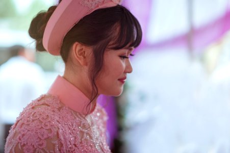 Person Taking Photo Of Black Haired Woman In Pink Floral Dress In Tilt Shift Photography
