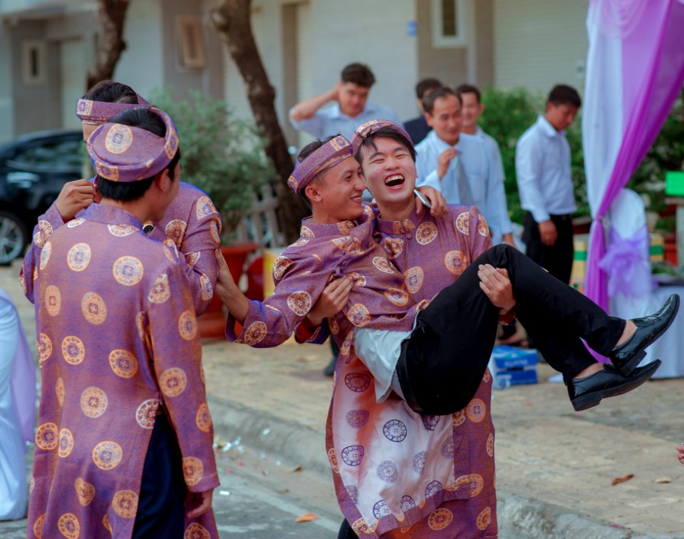 Several Men Wearing Purple-and-gold Traditional Dresses