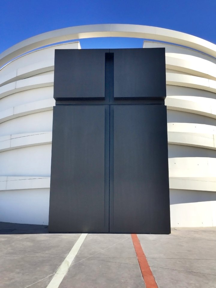 White And Black Concrete Building Under Blue Sky