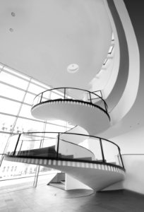 Grayscale Photo Of Spiral Stairs photo
