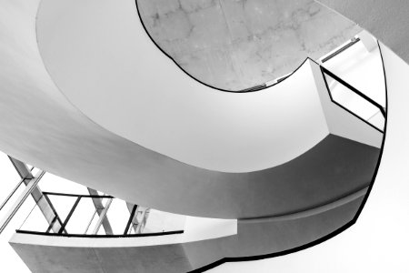 Grayscale Photo Of Spiral Stairs photo