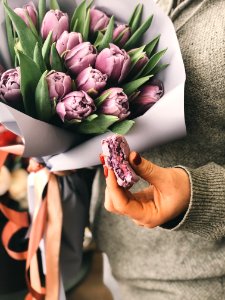 Person Holding Pink Tulip Bouquet photo