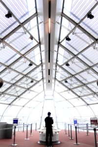 Man Wearing Black Top Standing Near Table