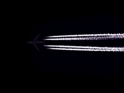 Photo Of Airplane Across The Clouds During Night Time