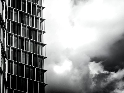 Grayscale Photo Of Glass Building photo
