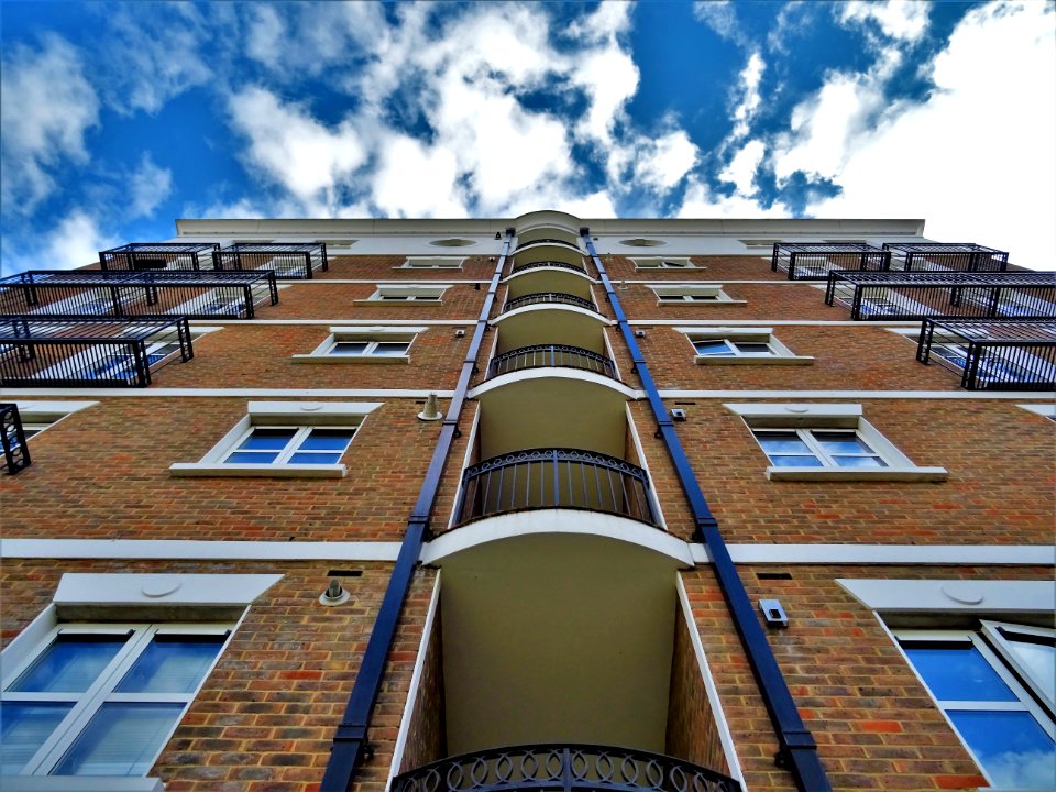 Low Angle Photography Of Brown Brick Building photo