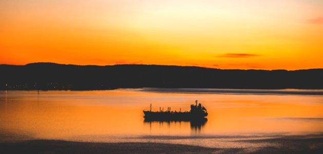 Silhouette Photography Of Mountain And Body Of Water