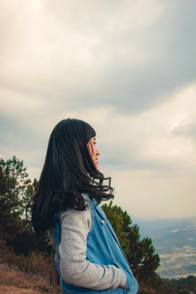 Woman In Gray And Blue Jacket