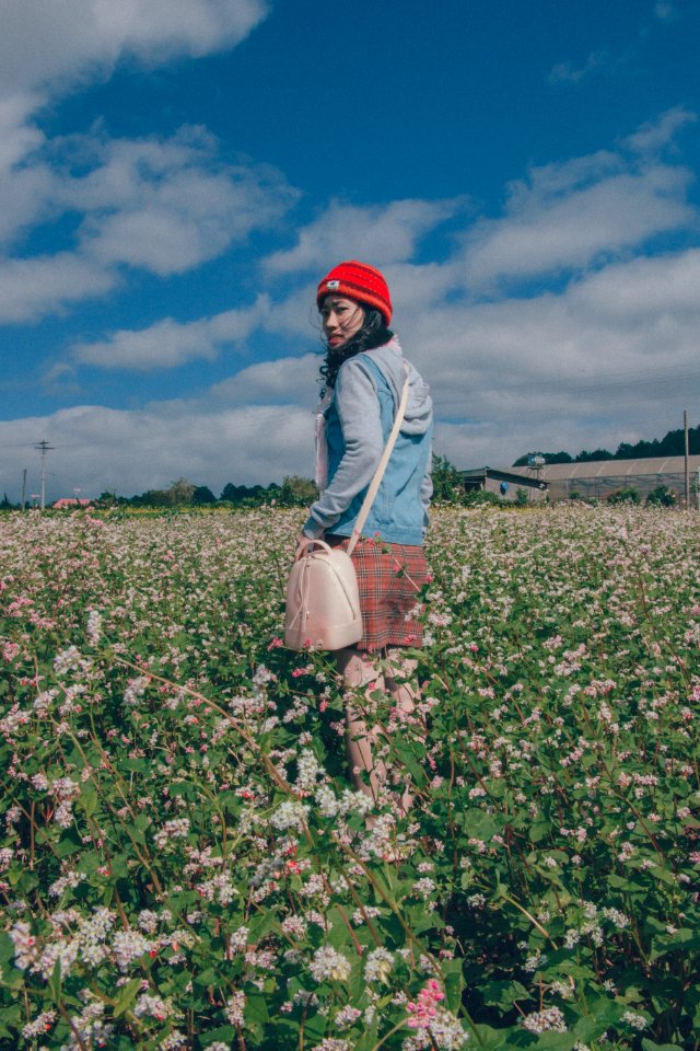Woman Wearing Red Knit Hat And Blue Hoodie Jacket