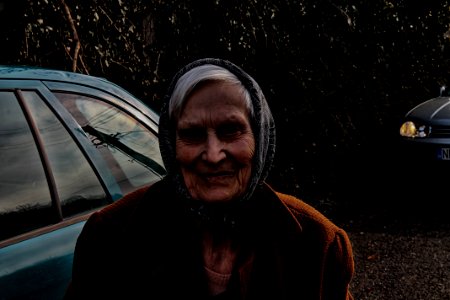 Woman Wearing Brown Jacket And Black Head Scarf photo