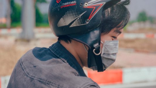 Selective Focus Photography Of Person Wearing Black And Red Helmet And Gray Mask photo