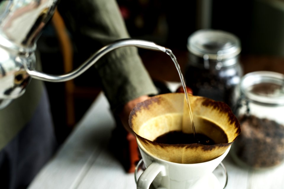 Shallow Focus Photography Of Kettle Pouring Water On Coffee Filter photo