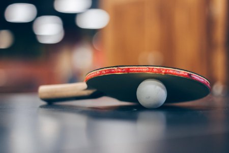 Selective Focus Photo Of Table Tennis Ball And Ping-pong Racket photo