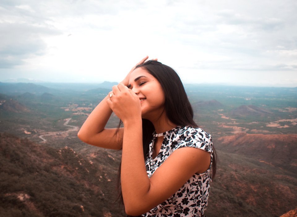 Woman Standing Peak Of Mountain
