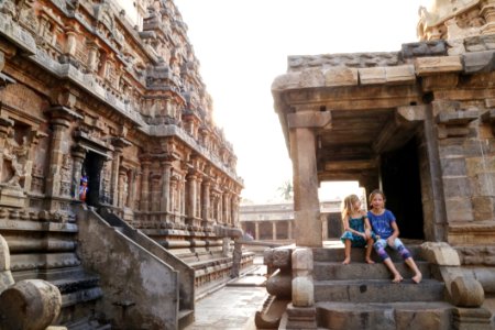 Two Girls Sitting On Gray Concrete Stair