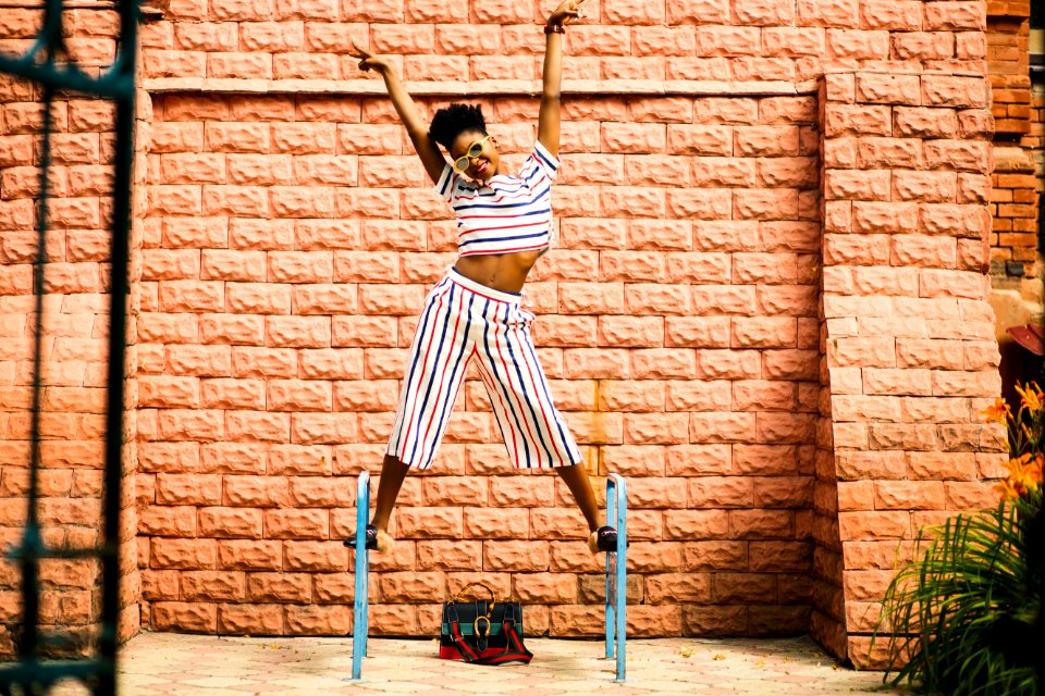 Woman In White-red-and-blue Striped Pants And Top