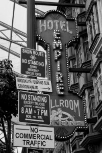 Grayscale Photo Of Hotel Empire Signage