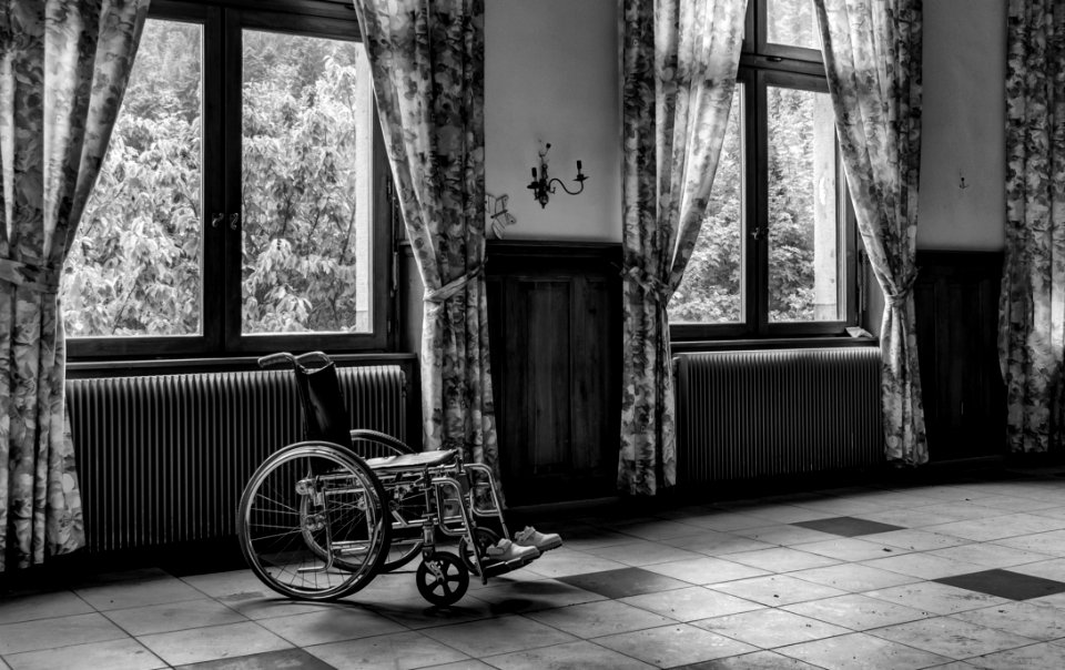 Grayscale Photo Of Wheelchair photo