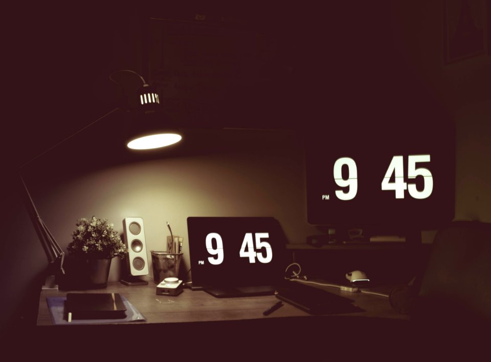 Turned On Black Desk Lamp On Top Of Table