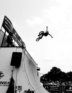 Grayscale Photo Of Bmx Rider On Tournament photo
