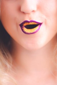 Woman With Purple And Yellow Lipstick