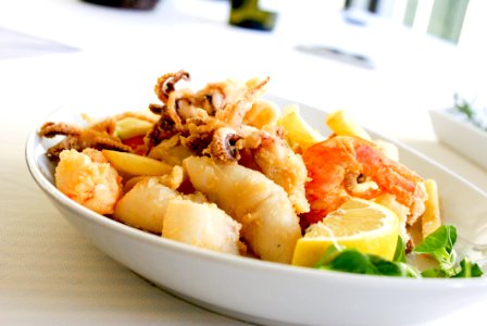 Deep Fried Shrimp And Squid With Slice Of Lemon On Ceramic Plate