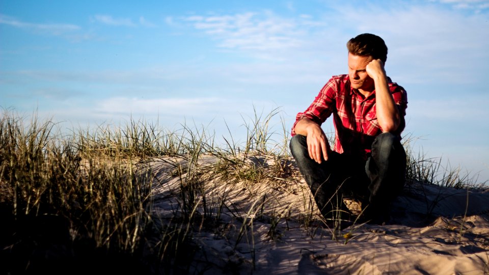 Shallow Focus Photography Of Man Wearing Red Polo Shirt photo