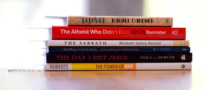 Six Assorted-title Books On White Desk photo