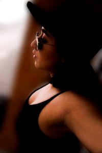 Woman Wearing Black Tank Top And Sunglasses photo