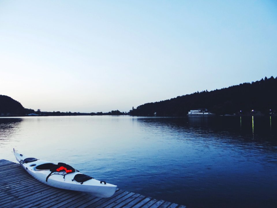 White Kayak On Brown Wooden Dock