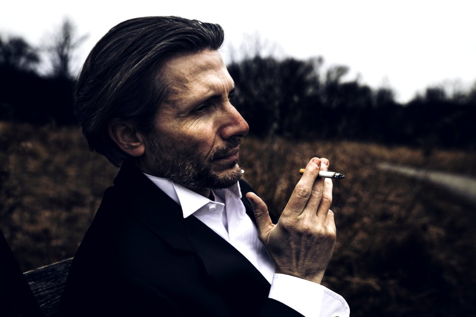 Photo Of Man Holding A Cigarette