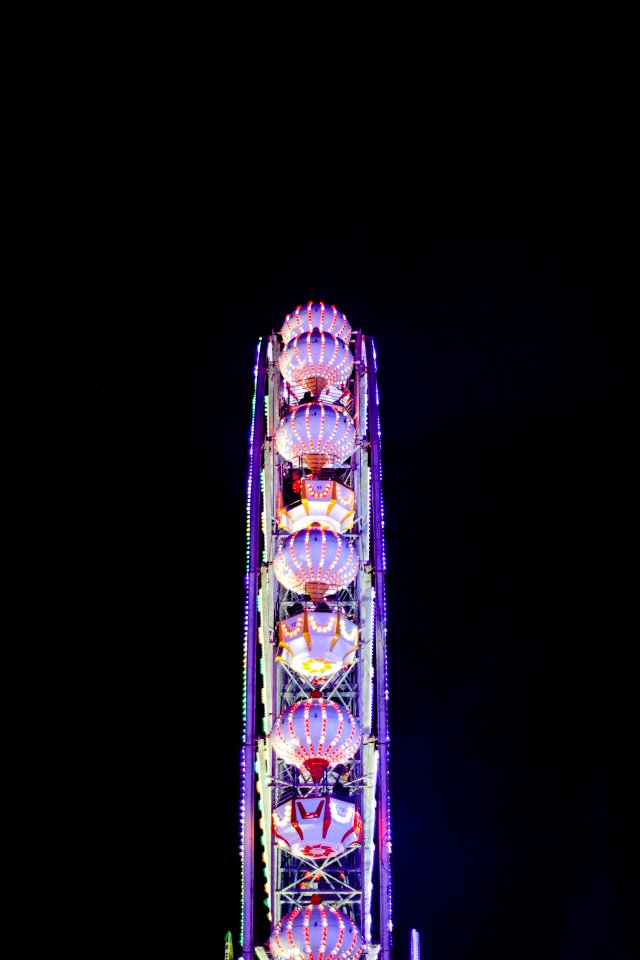 Illuminated Ferris Wheel At Night