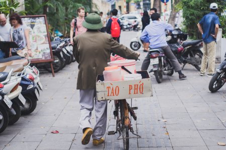 Man Walking With Bike