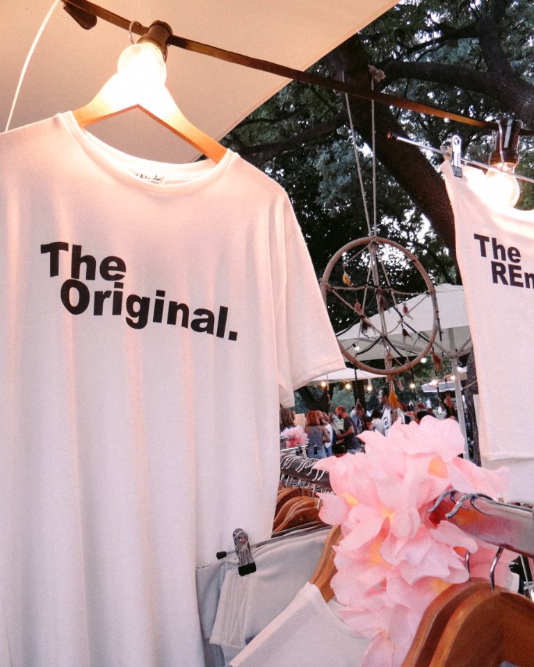 Photo Of Printed Shirt Hanging On The Wood