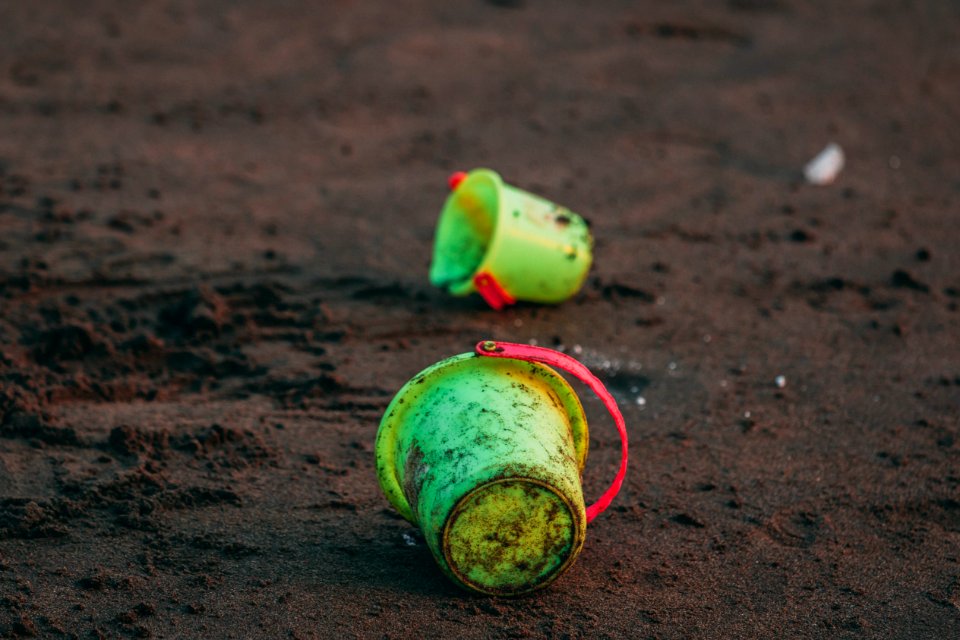 Two Green Pails On Ground