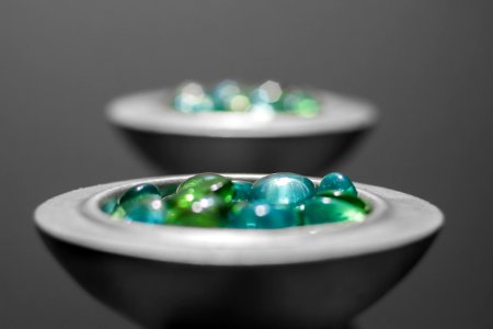 Multicolored Pebbles On White Ceramic Bowl