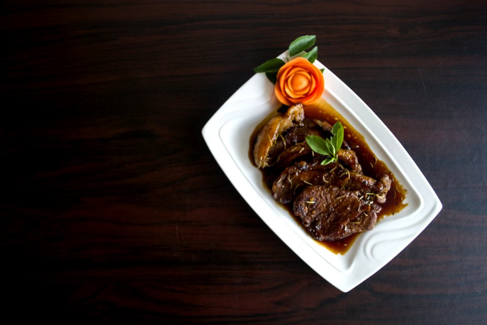 Meat With Sauce Dish On White Ceramic Plate
