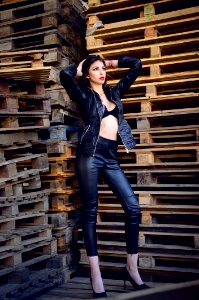 Photo Of A Woman Wearing Leather Jacket And Pants photo