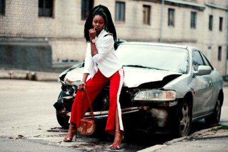 Woman With White Long-sleeved Shirt Red and White Slit Pants And Pair Of Black Open-toe Dorsay Heel Sandals Sitting On Wre photo