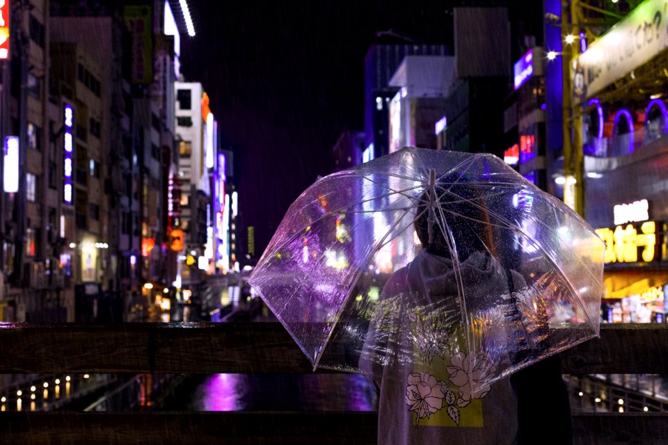 Photo Of A Person Holding An Umbrella