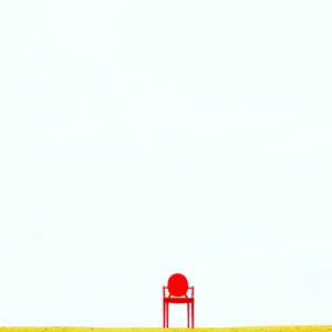 Red Armchair On Brown Surface