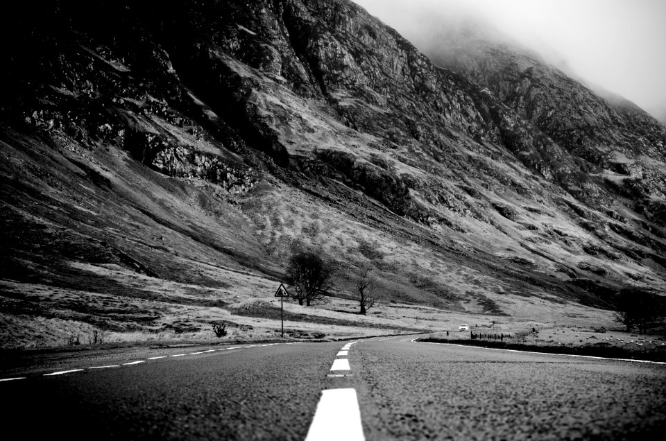 Grayscale Photo Of Road Thru Mountain