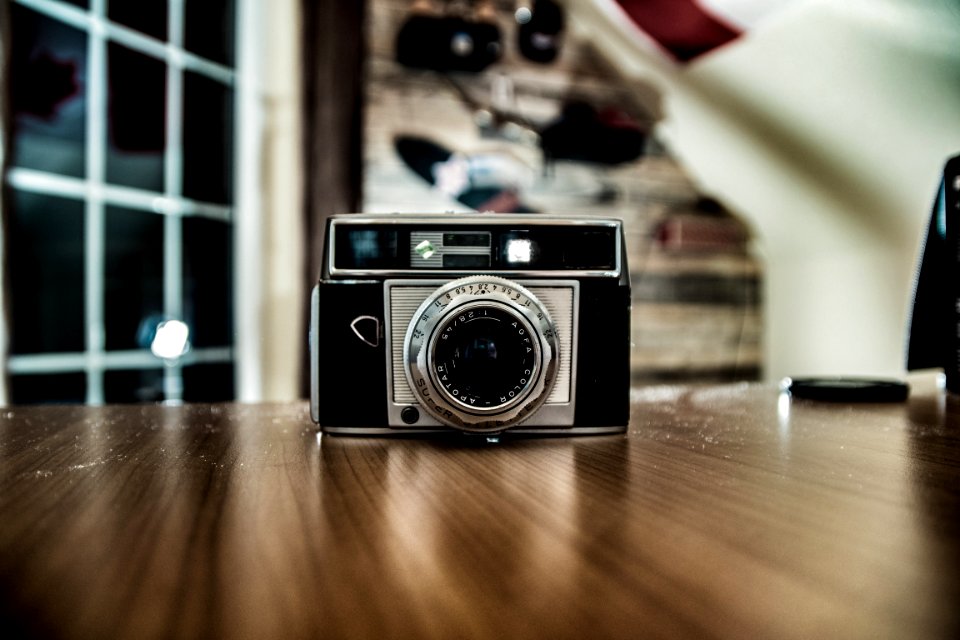 Silver And Black Shallow Focus Camera On Table
